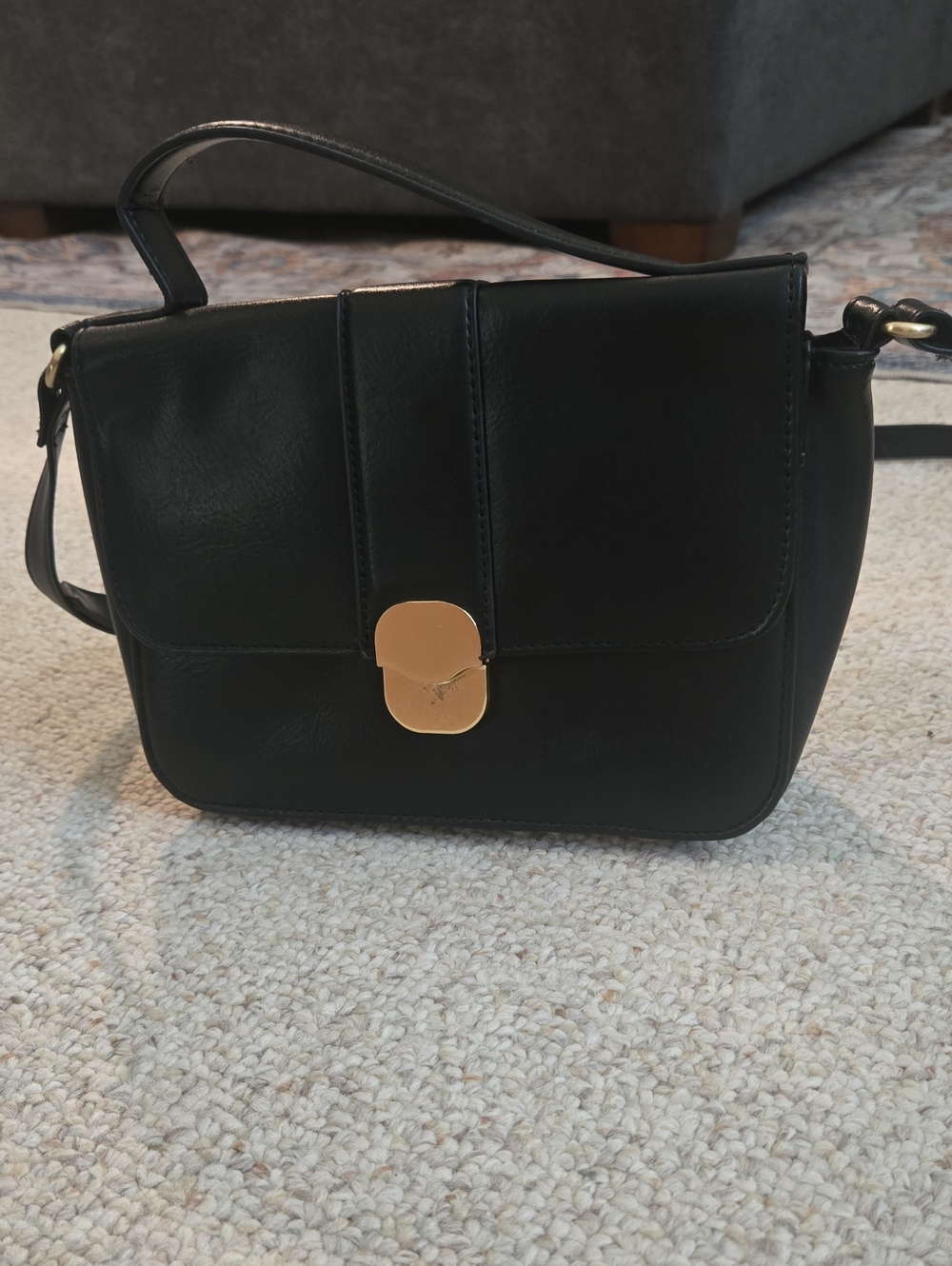 Elegant Black Crossbody Bag with Gold Accent